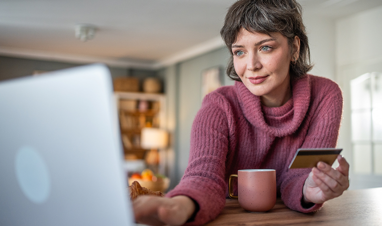 woman paying bill on computer