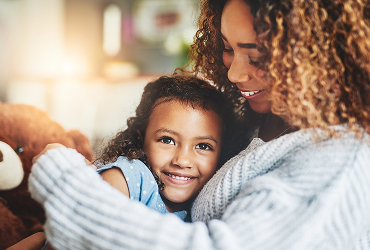 mother holding daughter