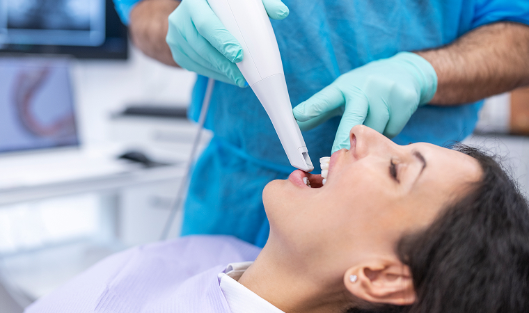 woman having intraoral camera used in mouth