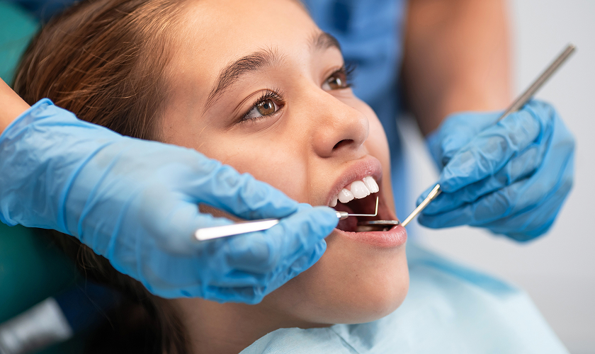 patient getting a cleaning at the dentist